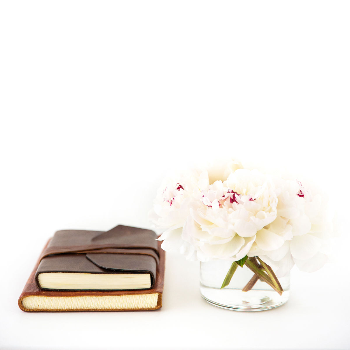 leather books flowers